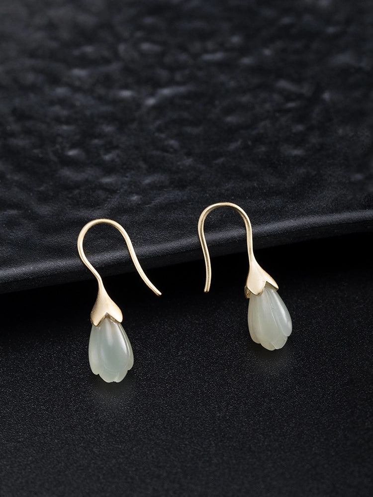 Minimalist Hetian jade flower earrings in soft jade green with vintage botanical style.