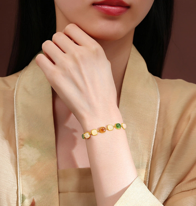 Eoela multi-color jade bracelet worn with beige outfit for elegant daily styling.