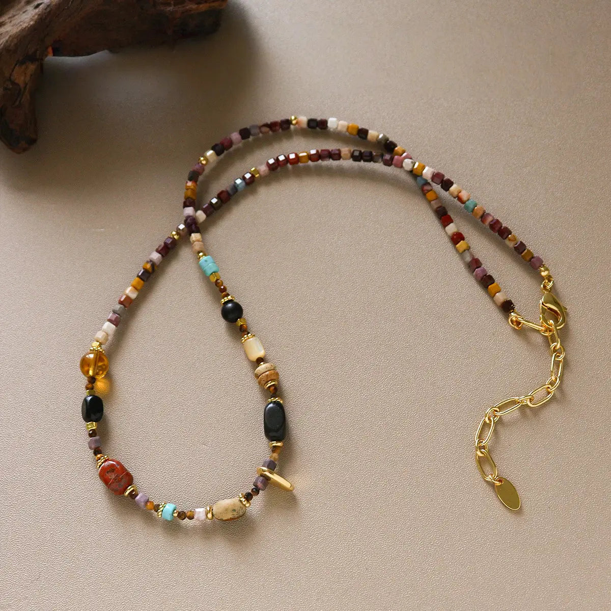 Boho multicolor stone beaded necklace with brass accents and adjustable gold chain
