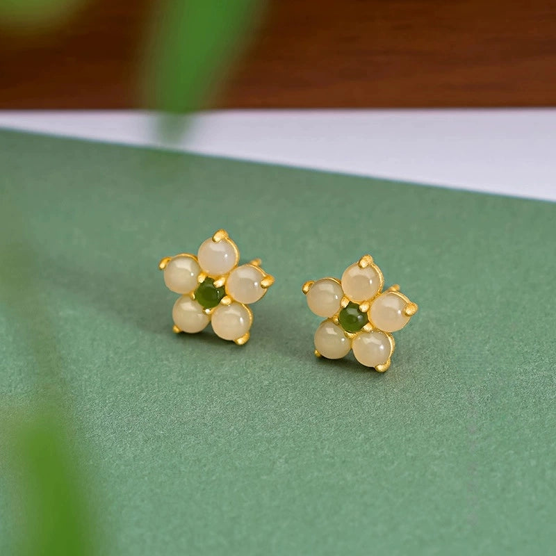 Dainty jade flower earrings with white Hetian jade petals and green Biyu jade center.