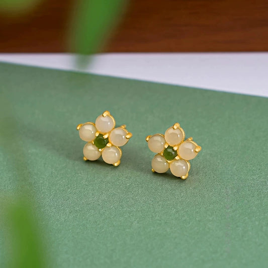 Dainty jade flower earrings with white Hetian jade petals and green Biyu jade center.