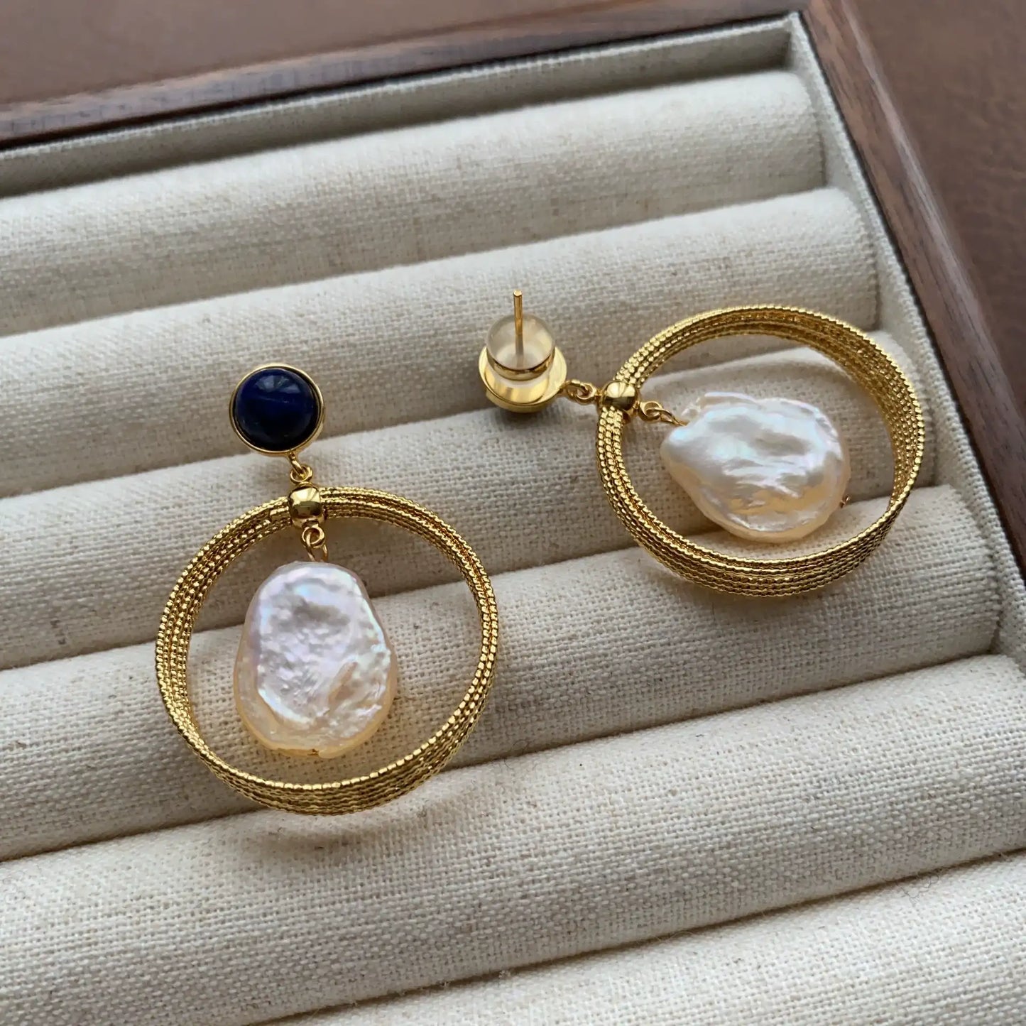 Back and front view of gold-plated lapis lazuli baroque pearl hoop earrings