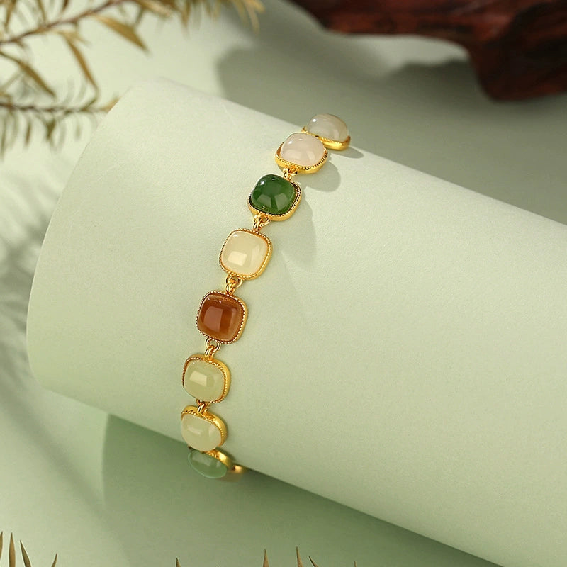 Close-up of geometric Hetian and Biyu jade bracelet with square beads and S925 chain.