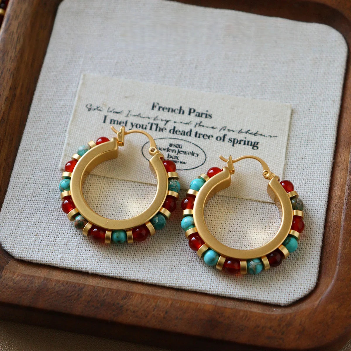 Red and turquoise beaded hoop earrings with copper frame in bohemian vintage style