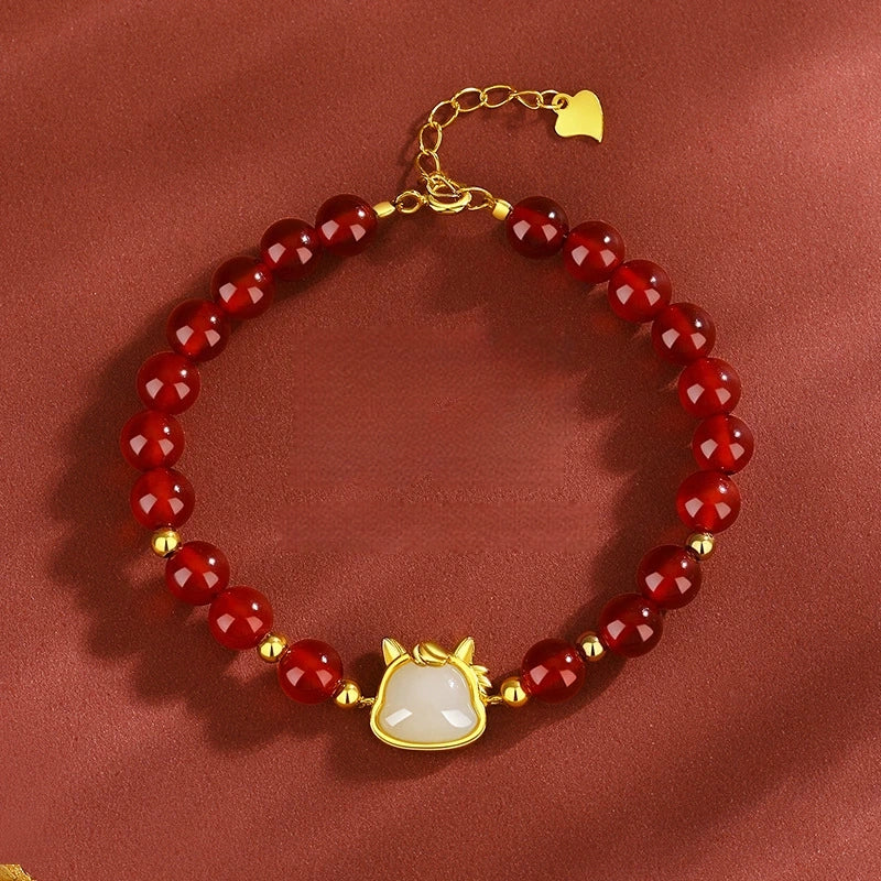 Red agate white jade horse bracelet with adjustable S925 extender chain.