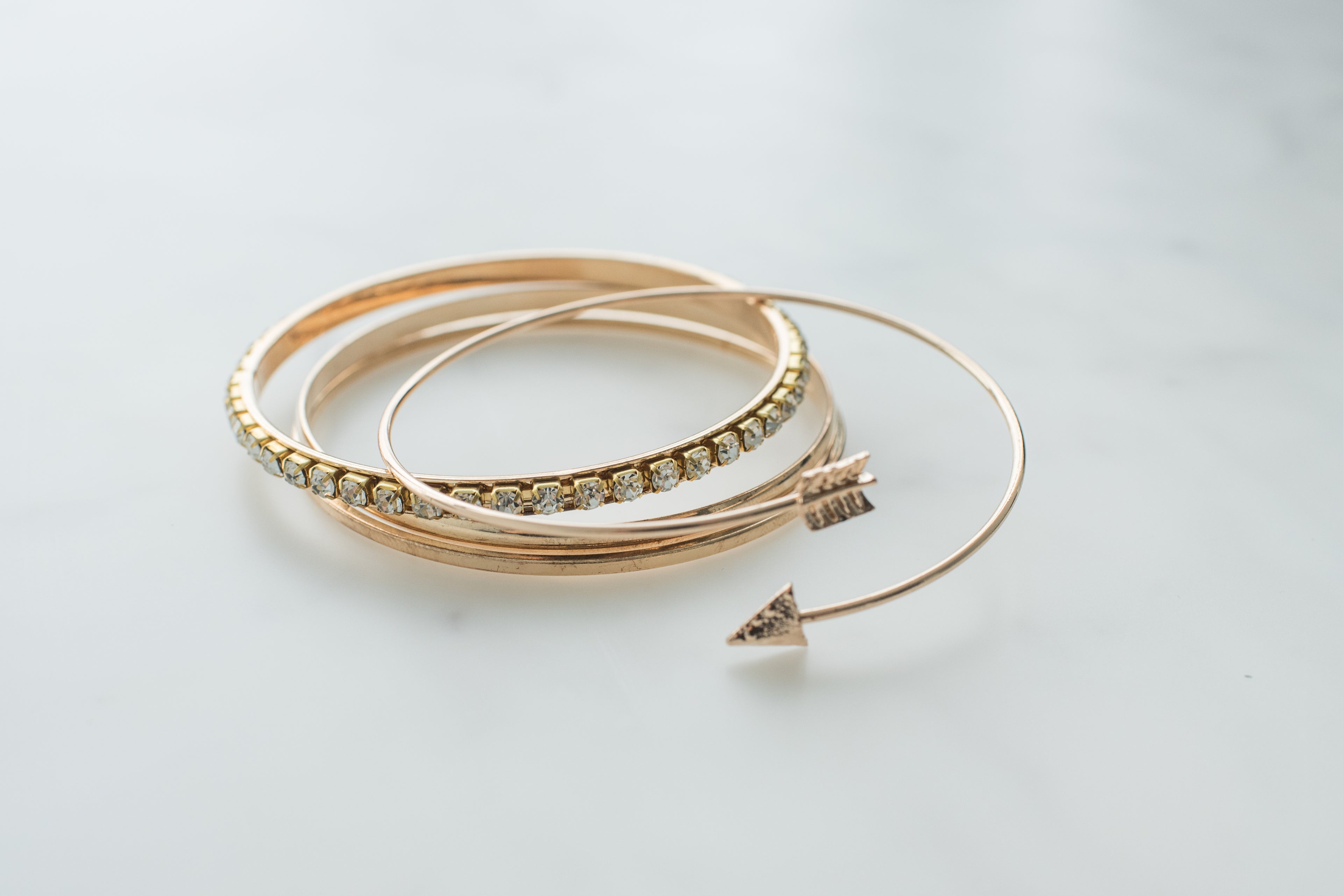 Eoela hero image featuring gold-tone bangle bracelets for elegant everyday jewelry styling.
